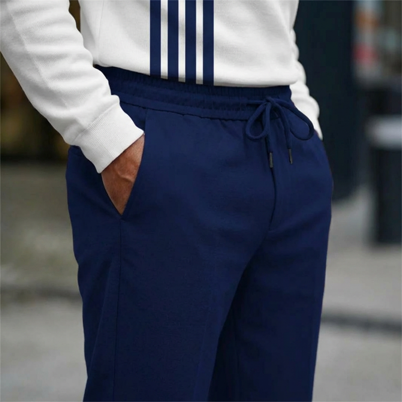 Conjunto de hombre con estampado gráfico: suéter y pantalón.
